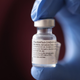 A nurse showing a container of Pfizer-BioNTech covid-19 vaccine.